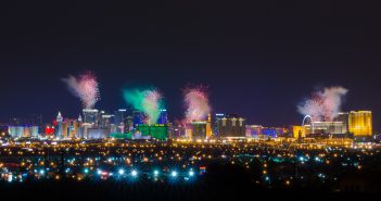 View of Las Vegas strip at night with firework display on New Year Day.