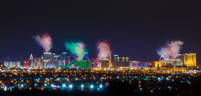 View of Las Vegas strip at night with firework display on New Year Day.