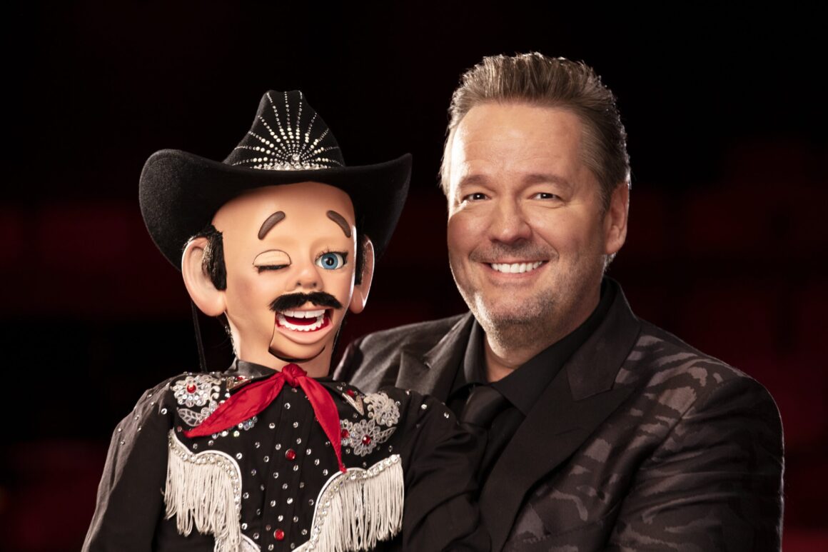 Terry Fator, known for his ventriloquist comedy, poses with his puppet.