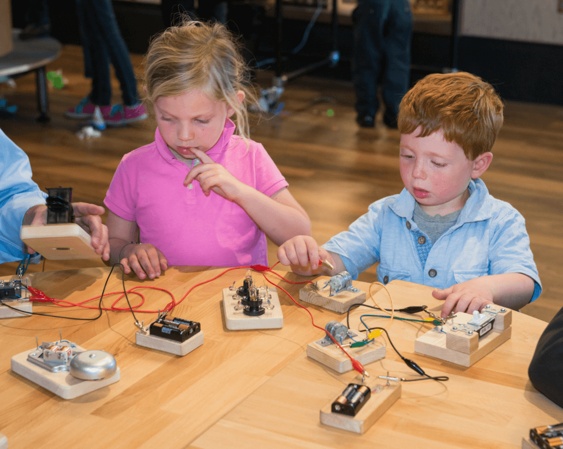 Children play in an interactive exhibit inside San Francisco's Exploratorium.